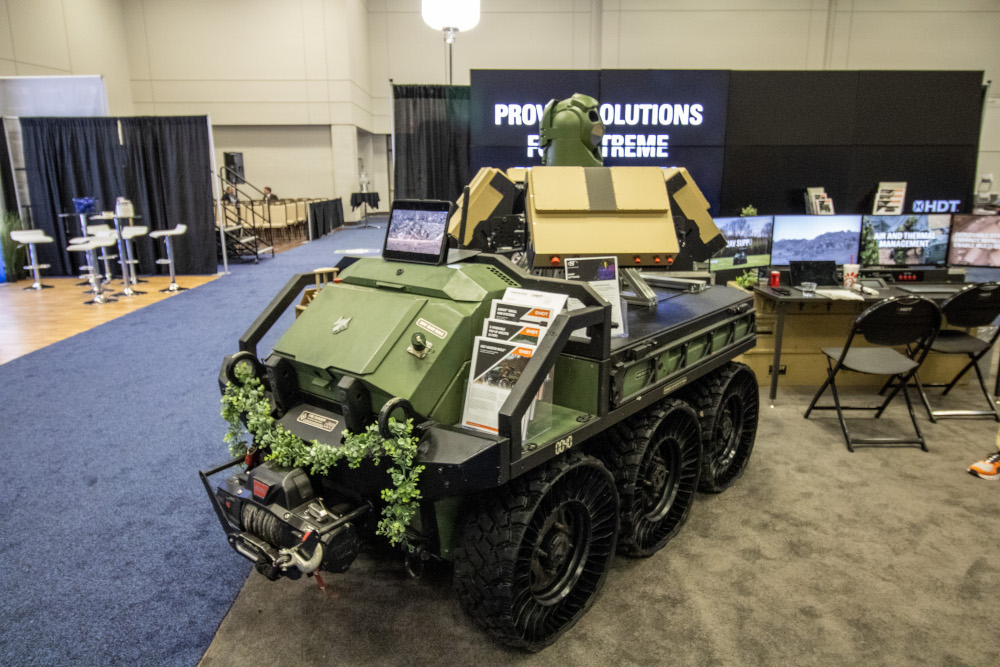 Dugan Meyer (CC0 1.0 Universal) A militarized off-road vehicle in an exhibition hall.